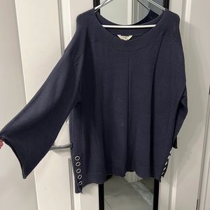 Blue sweater with buttons on the sides